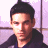 A 48x48 pixel buddy icon split into two sections: a left-side photo of a person with dark hair and a right-side green background with neon-style text reading "Original Icons .com".