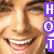 A pixelated close-up of a smiling person's face with visible teeth, accompanied by purple text blocks spelling 'HOT' vertically on the right.