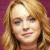 A pixelated image of a person with light brown hair against a purple background, next to blue text reading "Lohan Fan" on a light blue field.
