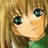 Pixelated close-up of a cartoon character's face with blonde hair, green eyes, and light skin tone against a brown background.