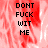 Pixelated text reads DONT FUCK WIT ME over a red and white blurred background with a gray section on the right.