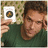 A person in a green shirt holds up a small card with a circular icon against a patterned background, showing slight head movement across frames.