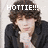 Pixelated image of a person with brown hair wearing dark jacket over light shirt, overlaid text reads HOTTIE!!! in white block letters.