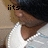Pixelated image of a person with dark hair wearing a white shirt, showing partial face and shoulder against light background.