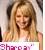Pixelated static image of a smiling person with long light brown hair wearing a sleeveless top, holding a sign with partially visible text.