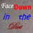 Pixelated text fragments in multiple colors arranged on a gray background with no visible animation.
