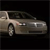 Pixelated side view of a silver sedan with visible headlights, grille, and wheel against a black background.
