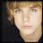 A static image of a person with light brown hair and blue eyes, displayed in multiple with text "Mrs. Linley" and pixelated hearts below