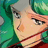 Pixelated close-up of a character's face with green hair, light skin, and dark eyes against a blurred background.