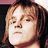 Static 48x48 pixel buddy icon showing a close-up of a person's face with light brown hair and neutral expression against dark background.