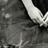 Pixelated grayscale image with abstract light and dark shapes, no discernible subjects or text.
