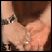 Animated sequence showing hands holding a small object with changing text overlays in a