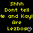 Yellow pixelated text on black background reads "Shhh Dont tell * and Kayl* Are Lezbos" with white heart symbols, repeated in a pattern