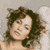 Static 50x50 pixel icon showing a close-up of a person with dark curly hair against a light gray background, rendered in low-resolution pixel art style with visible dithering and color blending.