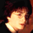 Pixelated static image of a person's face with warm lighting and dark background, appearing as an AOL Instant Messenger buddy icon.