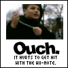 animated frames showing a person in a black jacket reacting to being hit with a Wii-Mote, with text reading "Ouch. IT HURTS TO GET HIT WITH THE WII-MOTE." below each frame