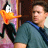 Pixelated static image of a cartoon duck character and a person in blue shirt against blurred background.