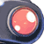 Pixelated static icon featuring a pink circular object with white highlights inside a dark blue and gray rounded frame.