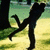Animated sequence showing a silhouette of a person in a park-like setting with text evolving from 'T' to 'TRUE LOVE' over time.