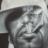 Pixelated grayscale static image of a human face with indistinct features and no visible text or symbols.