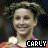 Pixelated static image of a person with curly hair and a smiling expression, featuring the name "CARLY" in blocky text at bottom right.