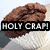 A brown muffin on a white plate with black text overlays reading 'HOLY CRAP!', 'a talking', and 'MUFFIN!' across three