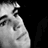 Static grayscale pixel art of a partial human face with visible facial features against black background, rendered in low-resolution 48x48 icon format.