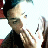 A person with dark hair and a dark top appears in two showing a hand gesture near the face