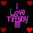 Pixelated icon with 'I Love Tiffany' text over a cupcake, surrounded by red hearts on a black background.