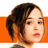A pixelated image of a person with brown hair tied back, wearing red lipstick and a dark top against an orange background with green text.