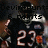 Pixelated image of a figure in dark clothing with light-colored hair, holding an object near the face, set against a blurred background with visible numbers and text.