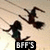 Two dark silhouetted figures on broomsticks fly against a light beige background with faint diagonal lines, one figure in green clothing, below a black banner with white text.