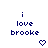 Blue pixelated text 'i love brooke' on white background with animated heart and arrow symbols changing position.