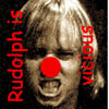 Static image of a person with light brown hair and a red clown nose, with red text reading "Rudolph is vicious" vertically on both sides.