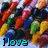 A pixelated image of colorful crayons with text reading "i love crayons!" in cyan block letters at the bottom.