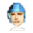 Pixelated portrait of a person wearing a blue helmet with dark side sections and light blue ear flaps, set against a solid gray background.
