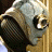 A 48x48 pixel buddy icon featuring a Hellboy character on the left and red text reading "HELL BOY 4.2.04" on the right, with visible dithering and low-resolution rendering artifacts.