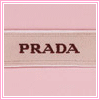 Static square icon with pink border and light pink background featuring centered dark brown 'PRADA' text on a beige horizontal band.