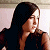 A 50x50 pixel animated contact sheet showing two frames of a buddy icon: left frame features a woman with long dark hair in profile, right frame displays green text on a dark background.