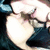 Pixelated static image of a character with light-colored hair and dark clothing, partially obscured by blurred background elements.