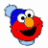 A 48x48 pixel animated buddy icon featuring Elmo from Sesame Street wearing a blue knit hat, repeated text "Elmo" in orange, and a green "Sesame Street" street sign on a white background with gray transparency areas.