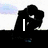 Silhouette of two figures embracing with text "I LOVE YOU" overlaid across four