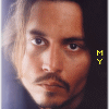 A static image of a person with long hair and facial hair, featuring vertical yellow text on the right side.