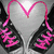 A pixelated icon shows a black bikini top with pink floral patterns and a pink strap forming a heart shape above the garment against a gray background.