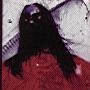 Animated image of a figure with long dark hair covering the face, wearing red clothing against a light patterned background.