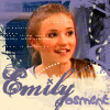 A static image of a person with light brown hair in a ponytail wearing a white shirt with blue text, set against a blue and white background with decorative elements.