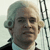 A historical figure with powdered white hair in a black coat and white cravat appears in two side-by-side with a ship rigging background, while a smaller figure in period clothing stands below