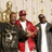 Pixelated image of three figures in formal attire with a golden statue, alongside text reading '36 mafia' on a black background.