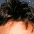 Animated sequence showing a person's face with dark hair, transitioning from closed eyes to open eyes and then to a mouth view.