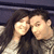 Two figures with light skin and dark hair embrace closely, their faces partially obscured by pixelation.